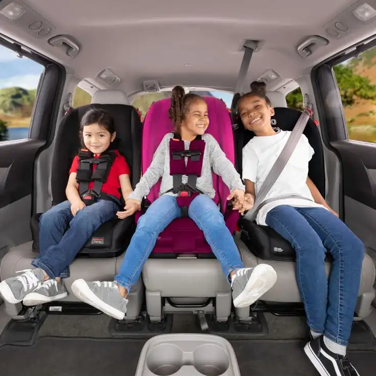 Child in a certified car seat during a private transfer to Disneyland Paris